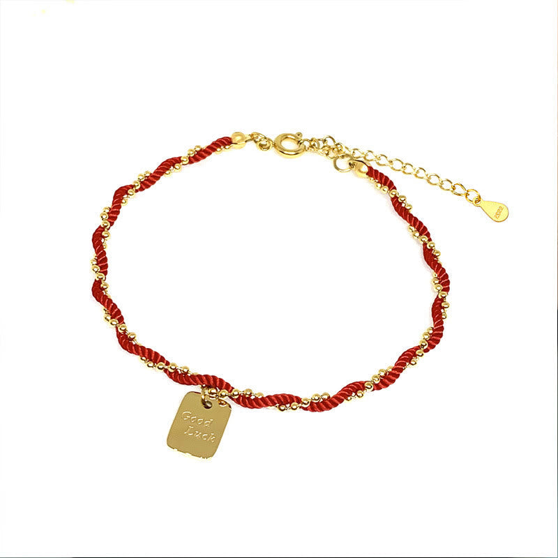 Bracelet porte-bonheur en fil rouge avec breloque en cuivre plaqué or pour la force