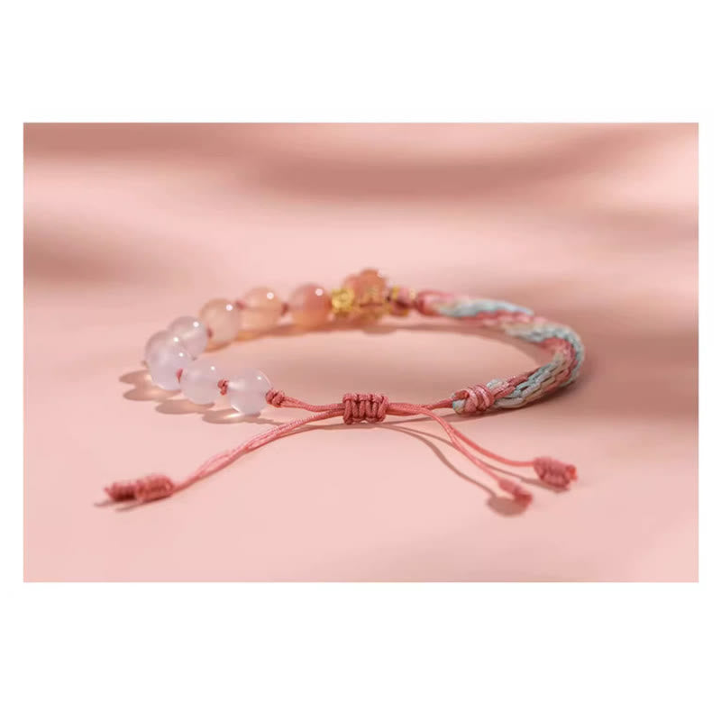 Bracelet en agate à nœud de réincarnation avec breloque en fleur de pêcher