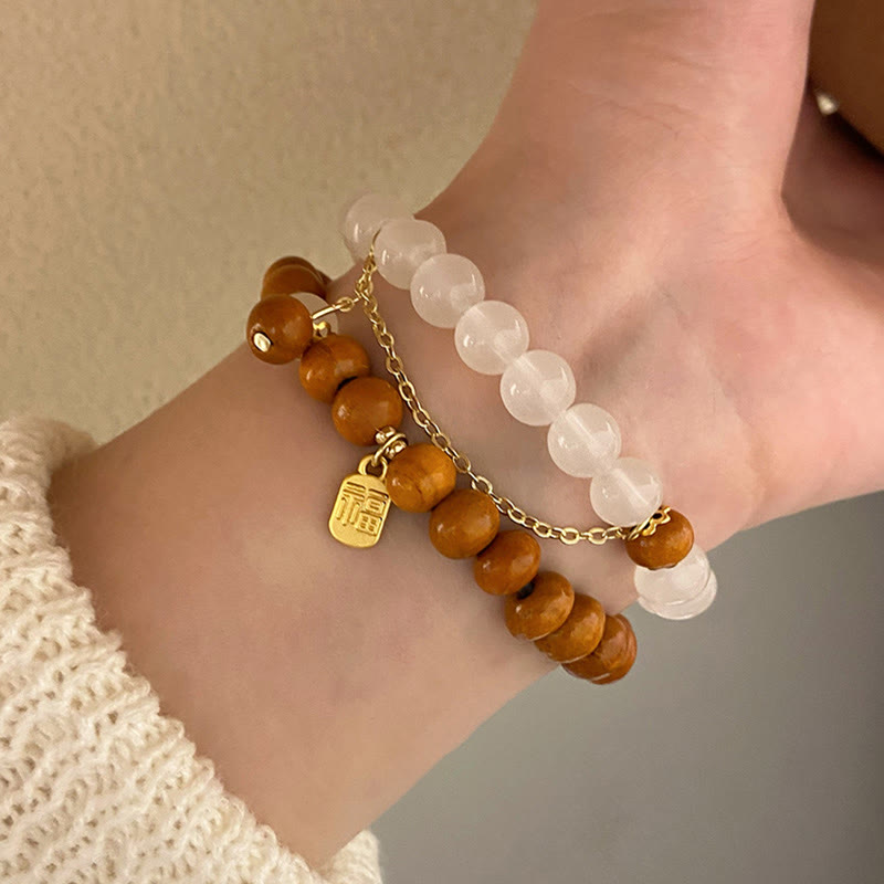 Bracelet de protection à breloques Fu œil de chat en bois de santal