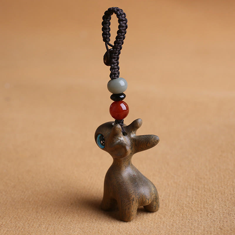 Porte-clés mini-protection contre les cerfs en bois de santal 35 mm