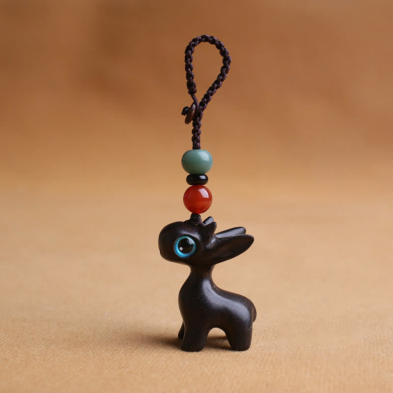 Porte-clés mini-protection contre les cerfs en bois de santal 35 mm