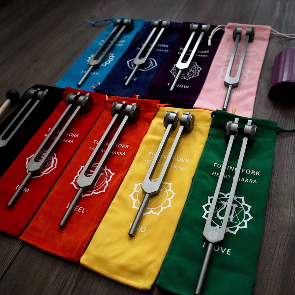 Solfeggio Tuning Fork Set in colorful chakra sleeves for healing and sound therapy