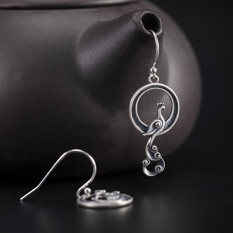 Boucles d'oreilles spirituelles en argent sterling avec motif paon