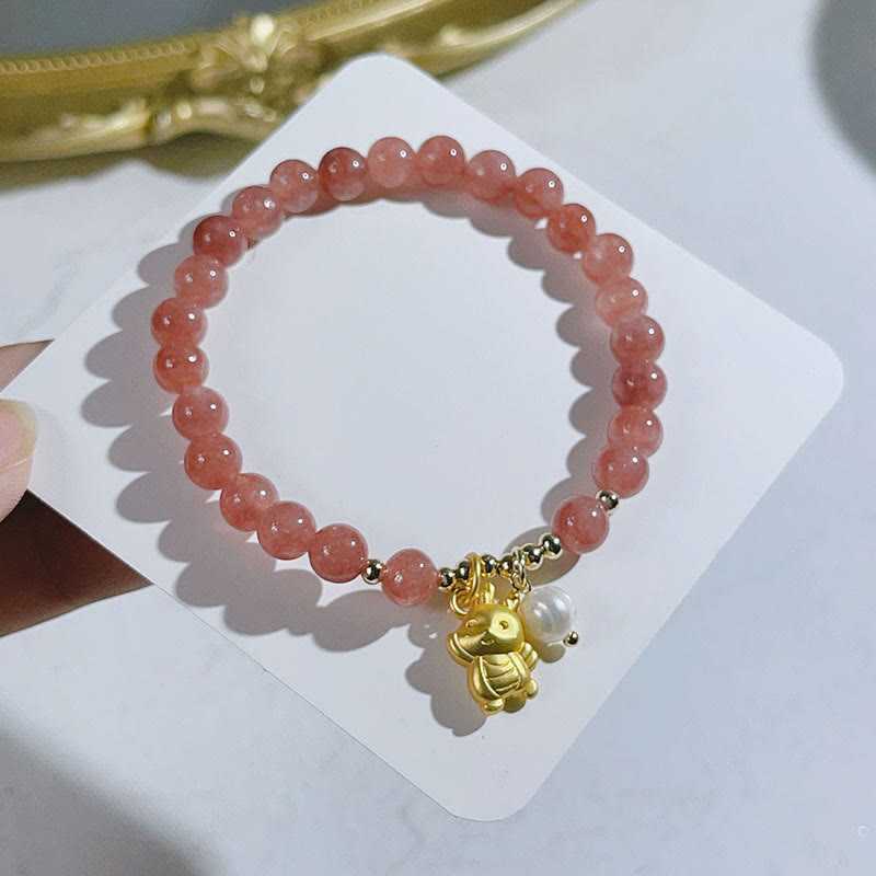 Bracelet de protection à breloques en quartz fraise et perle de dragon