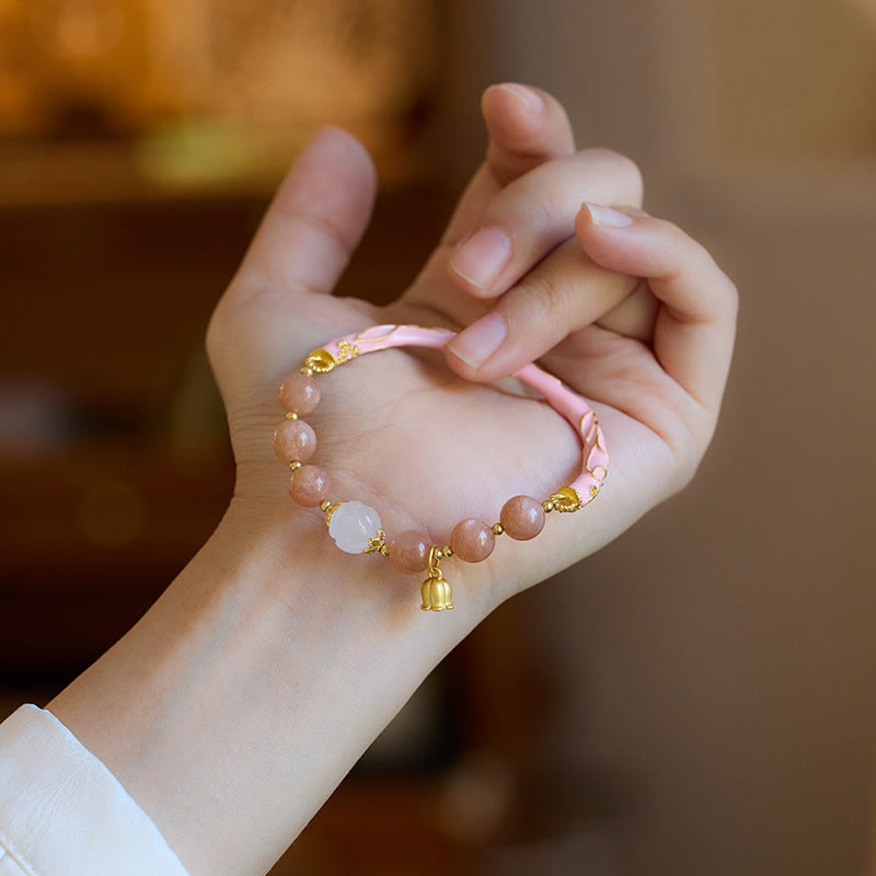 Bracelet à breloques positives en pierre de soleil et jade de soie dorée
