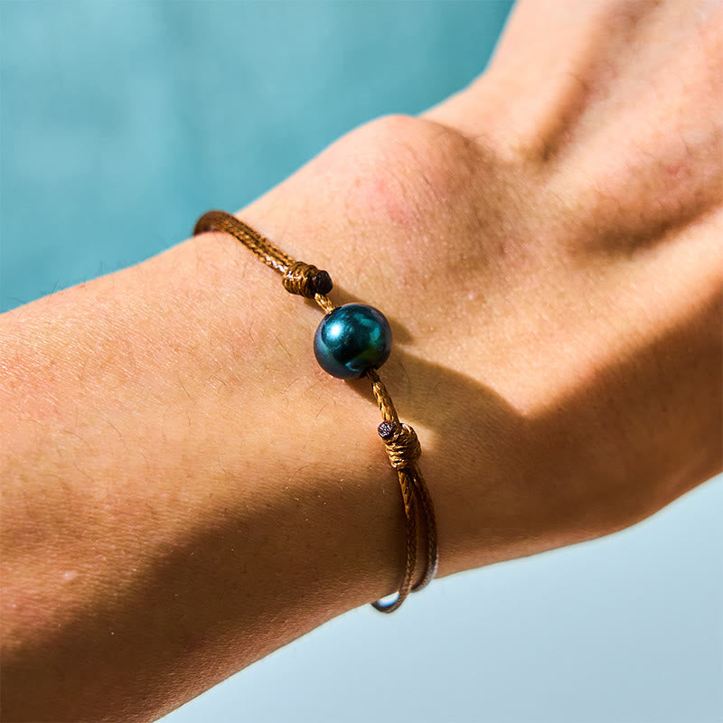 Bracelet de guérison en perles noires de Tahiti sur corde cirée 14-19 cm