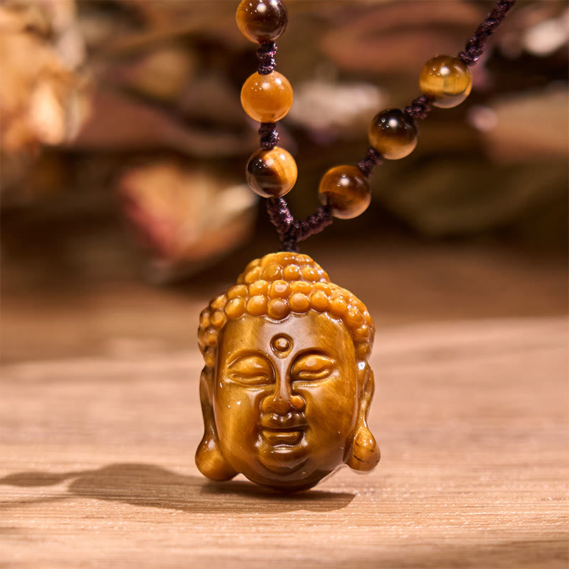 Collier pendentif courage tête de Bouddha œil de tigre