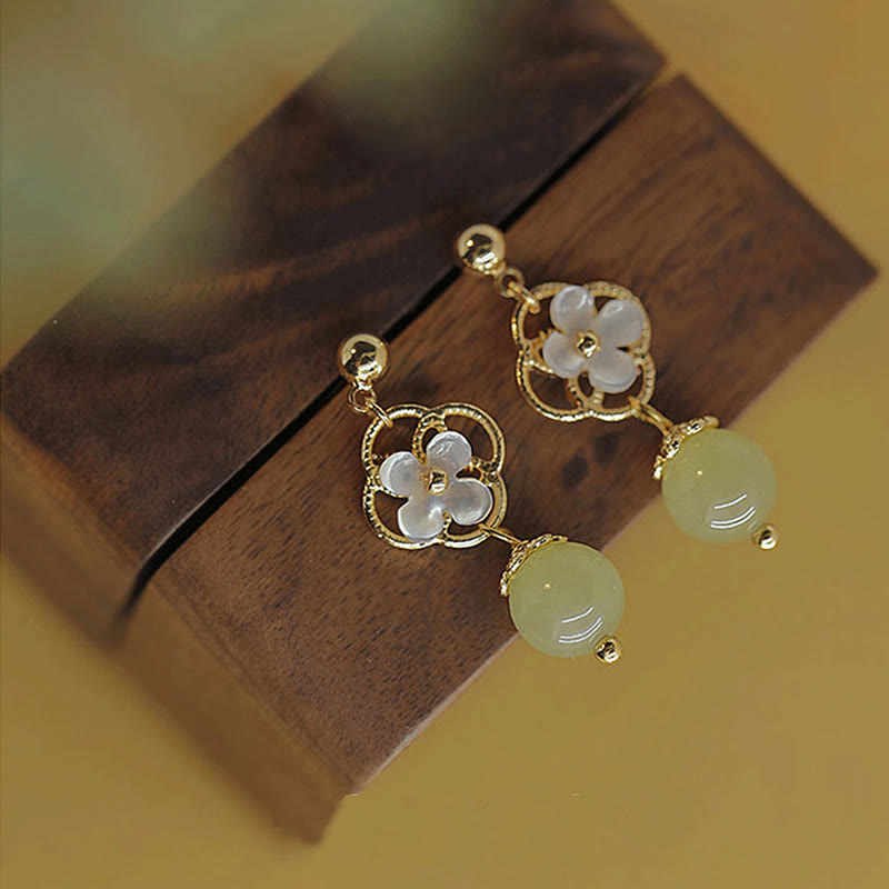 Boucles d'oreilles pendantes en jade Tridacna pour la prospérité et le calme