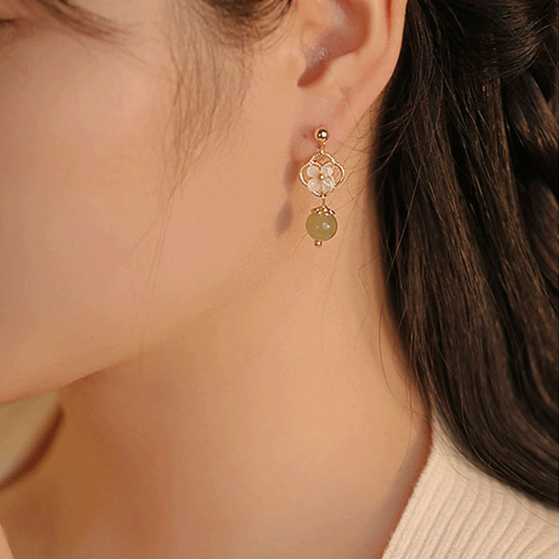 Boucles d'oreilles pendantes en jade Tridacna pour la prospérité et le calme