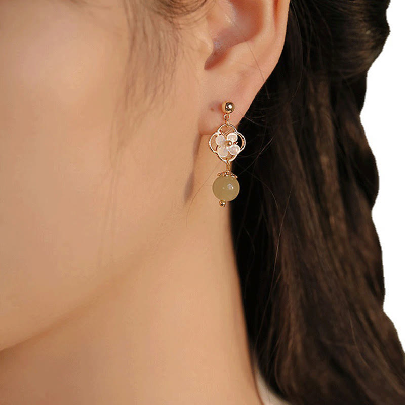Boucles d'oreilles pendantes en jade Tridacna pour la prospérité et le calme