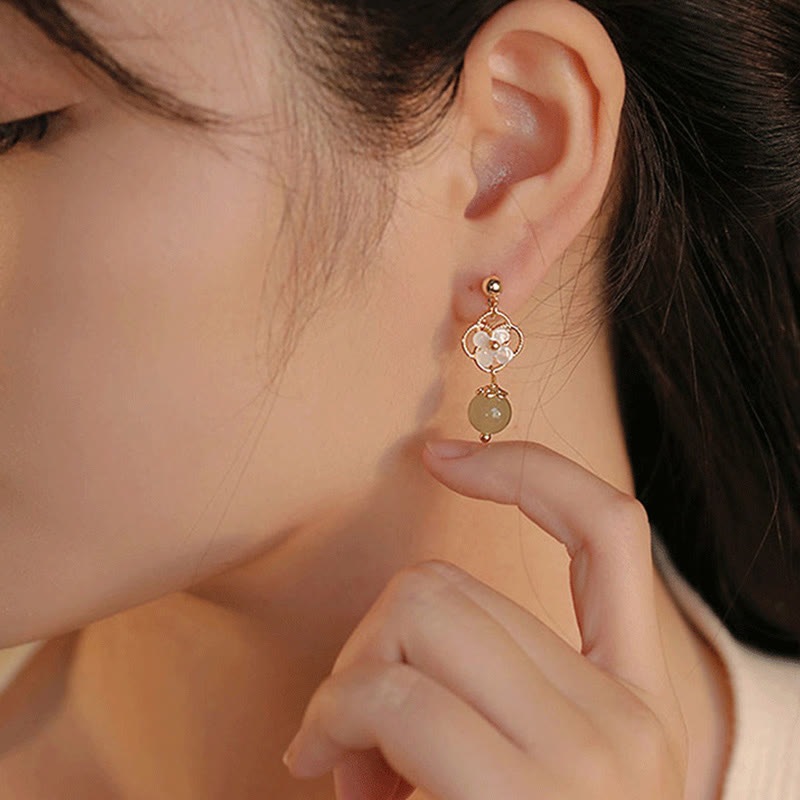Boucles d'oreilles pendantes en jade Tridacna pour la prospérité et le calme