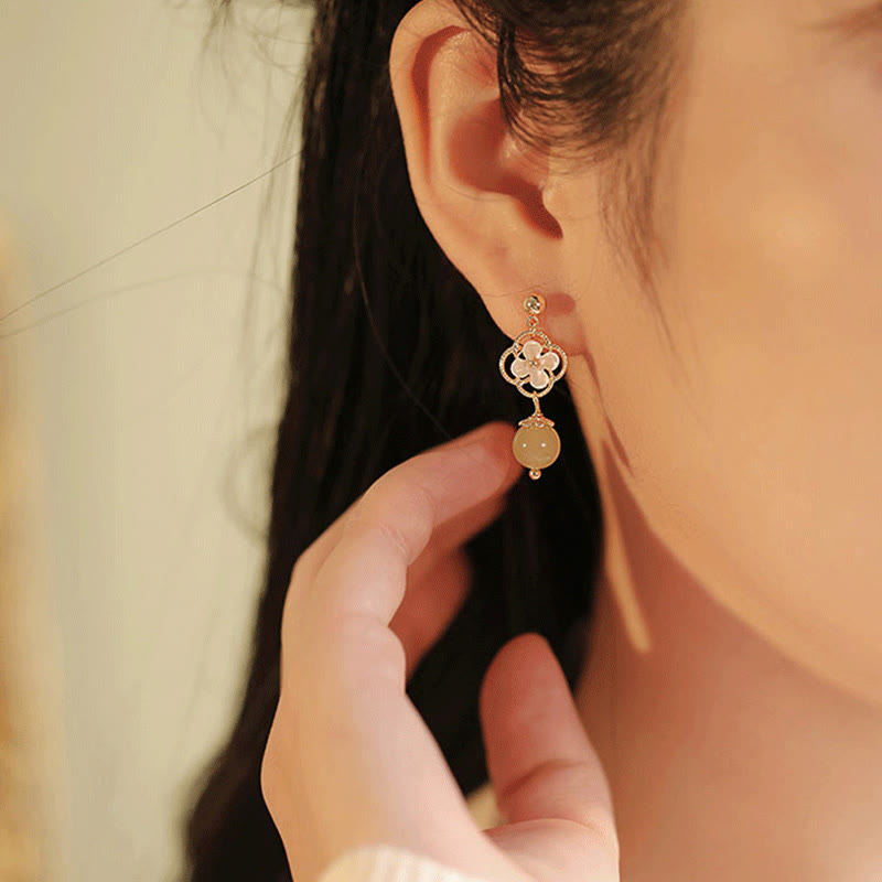 Boucles d'oreilles pendantes en jade Tridacna pour la prospérité et le calme