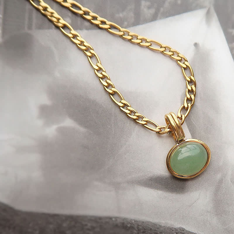 Collier pendentif ovale turquoise en acier titane