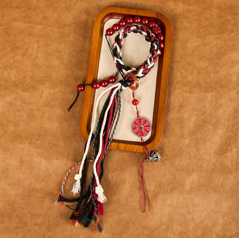 Bracelet unisexe en cinabre avec pompon en corde rouge tibétaine