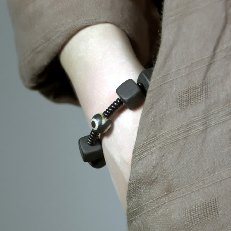 Bracelet spirituel unisexe en perles dzi en bois d'ébène pour la force
