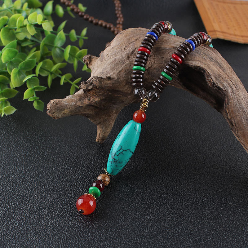 Collier en bois de wengé turquoise pour la protection et le calme 80 cm