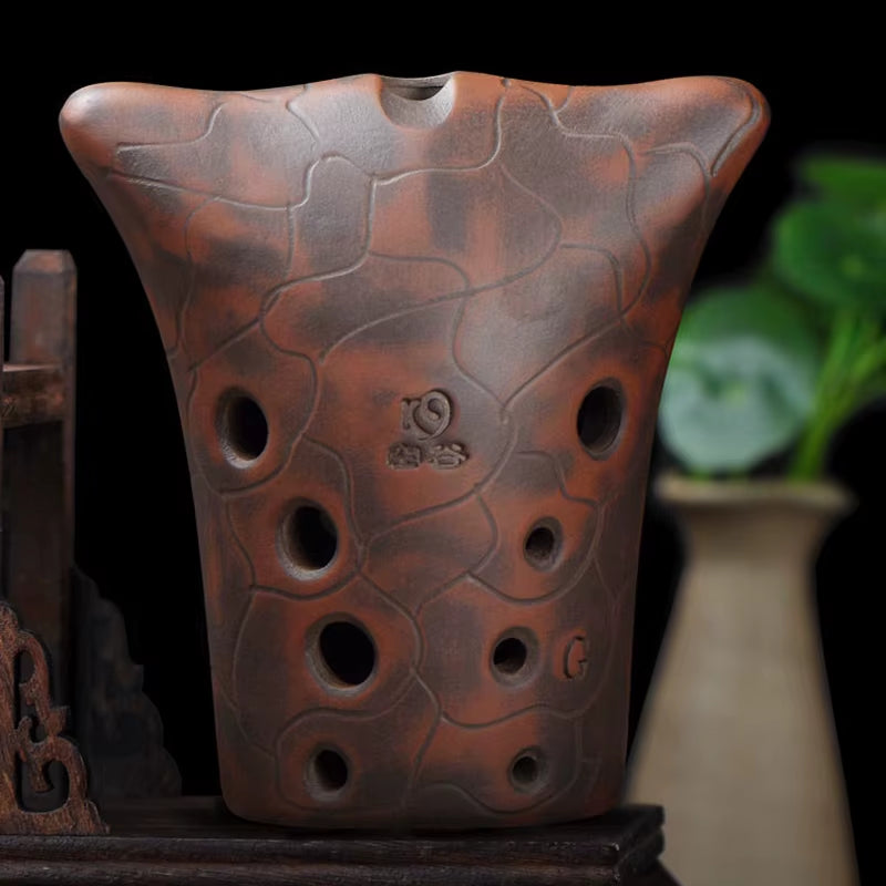 Clay 10-Hole Double Cavity Chinese Xun Musical Instrument with textured reddish-brown surface