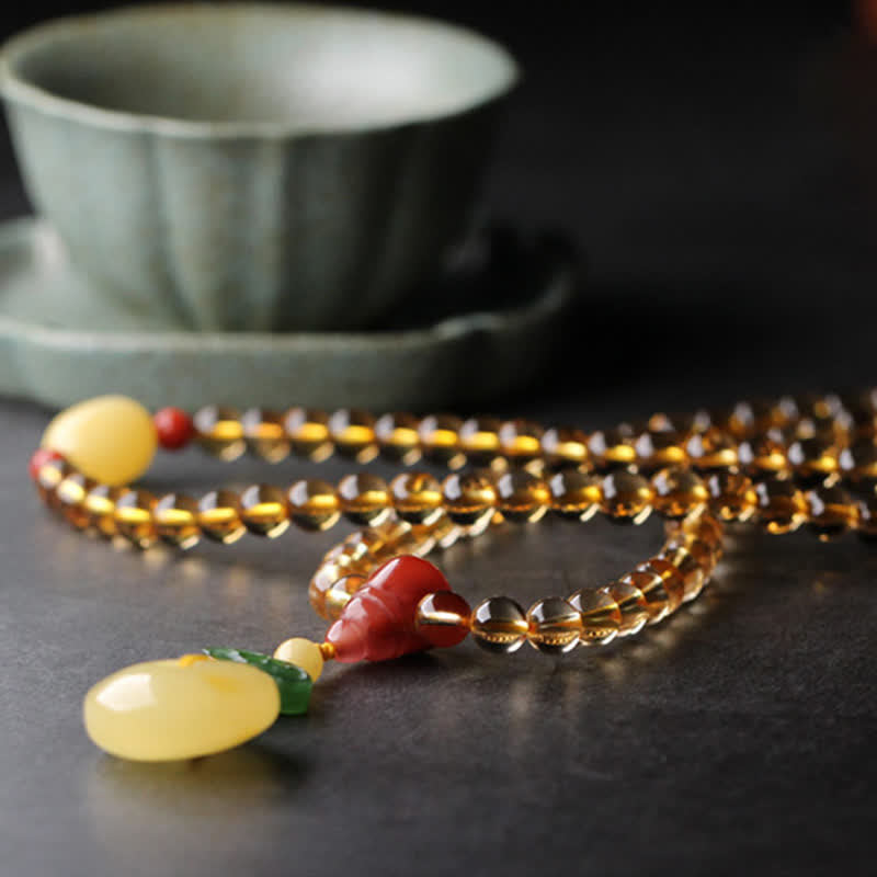 Bracelet Mala 108 perles en citrine et ambre pour la paix