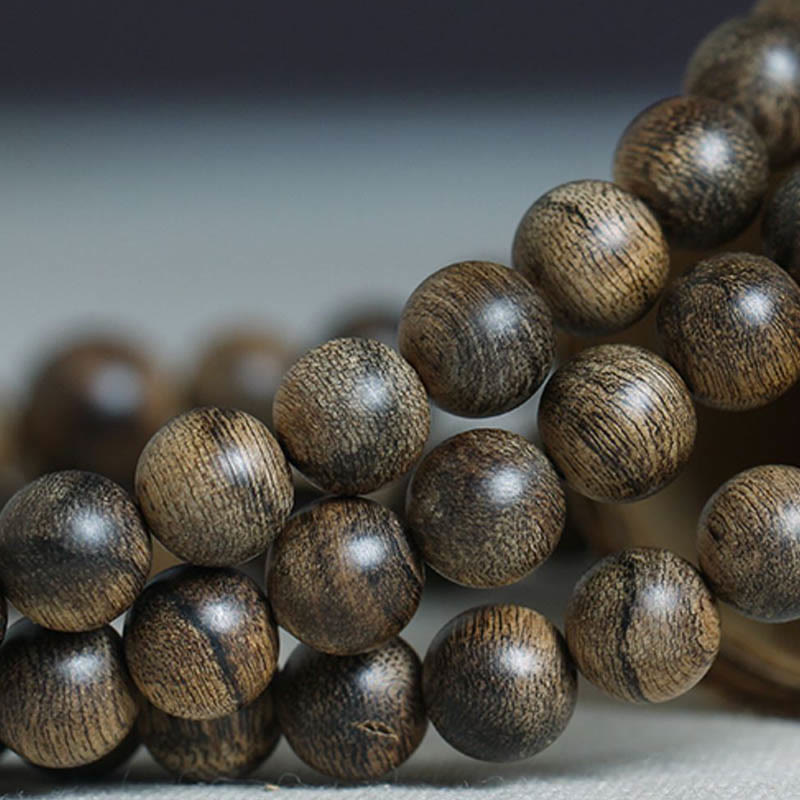 Bracelet Mala en bois d'agar Tarakan de 108 perles pour la protection