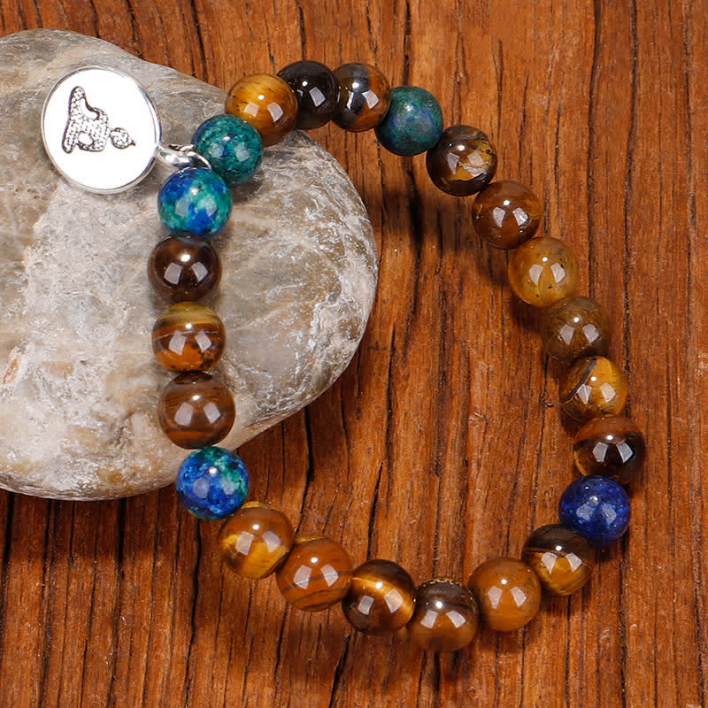 Bracelet de force 108 perles en œil de tigre avec pompon Bouddha