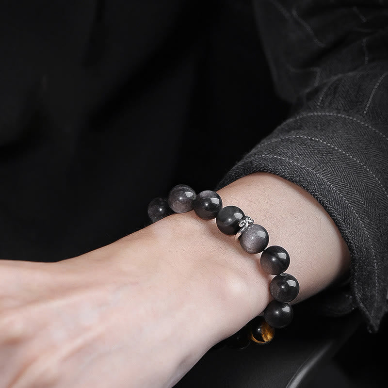 Bracelet Om Mani Padme Hum en obsidienne œil de tigre argenté brillant de 10 mm