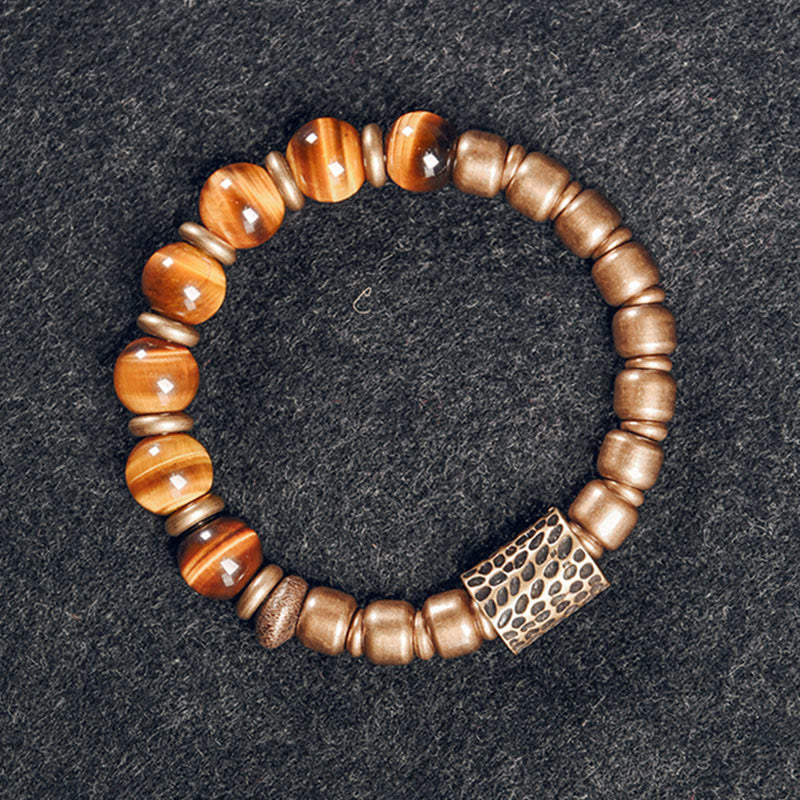 Bracelet de protection œil de tigre 10 mm avec accents cuivrés