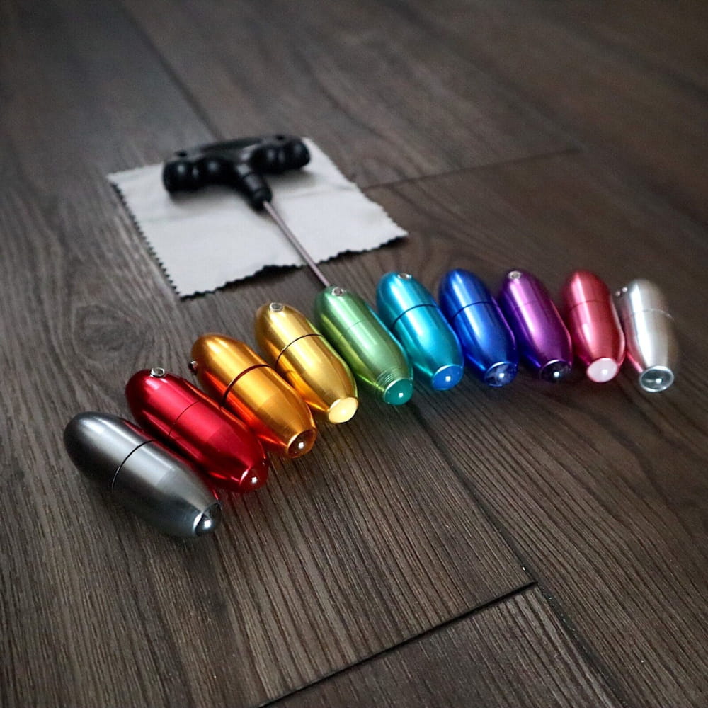 Colorful metallic bullet-shaped vials in rainbow sequence for Tuning Fork Set