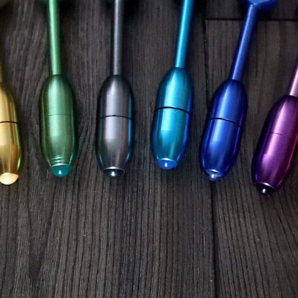 Metallic rainbow-colored pens arranged in a row for art and craft projects