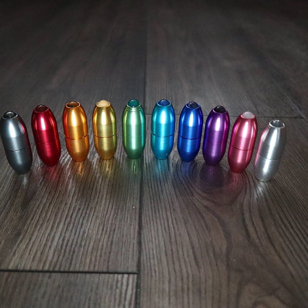 Row of metallic rainbow-colored tuning forks for massage and biofield therapy