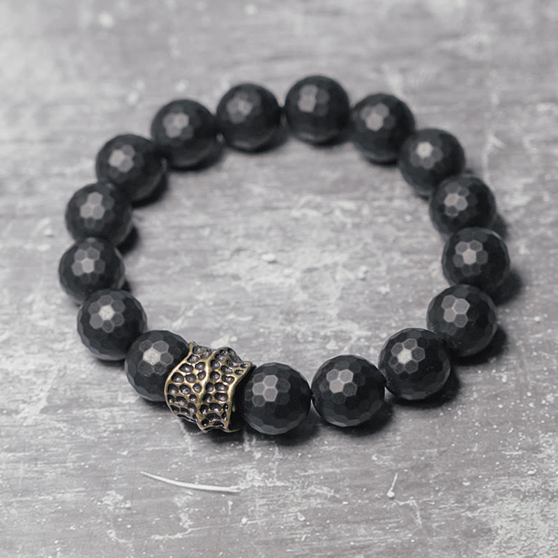 Bracelet de protection en onyx noir 12 mm avec accents cuivrés | Sons de guérison