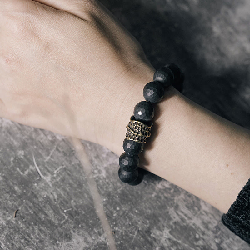 Bracelet de protection en onyx noir 12 mm avec accents cuivrés | Sons de guérison