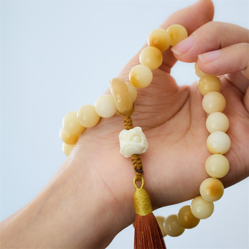 Mala de poignet en graines de Bodhi de 12 mm avec breloque lion dansant pour l'harmonie