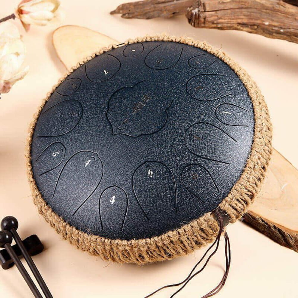 Black steel tongue drum with rope-wrapped edges, 14 Inch Carbon Steel, 15 Notes D Key