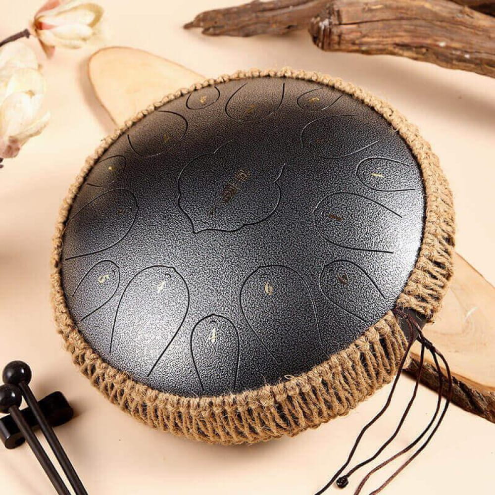 14 Inch Carbon Steel Tongue Drum with etched spirals and rope-wrapped edges in D Key