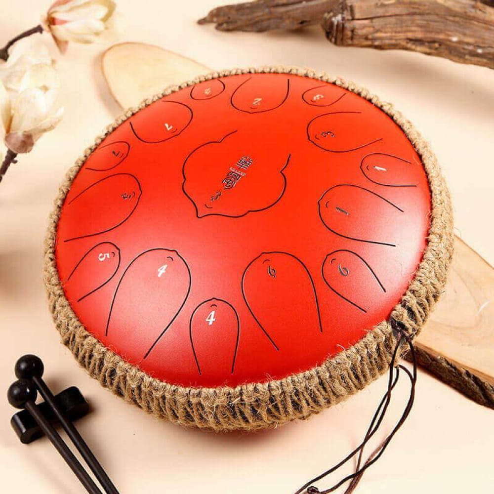 Red Carbon Steel Tongue Drum with numbered tone zones and rope-wrapped edge