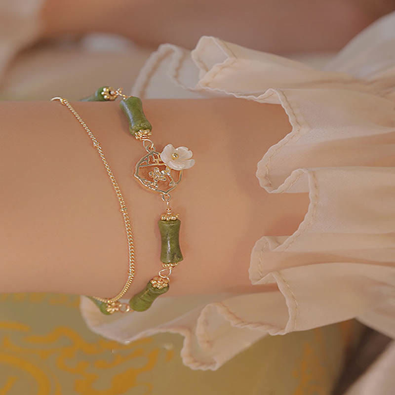 Bracelet spirituel en péridot plaqué or 14 carats avec fleur de bambou