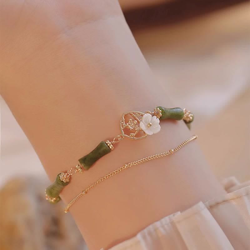 Bracelet spirituel en péridot plaqué or 14 carats avec fleur de bambou