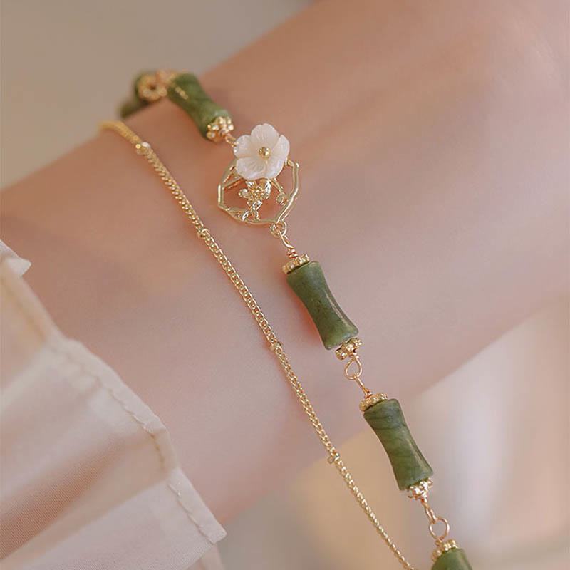 Bracelet spirituel en péridot plaqué or 14 carats avec fleur de bambou