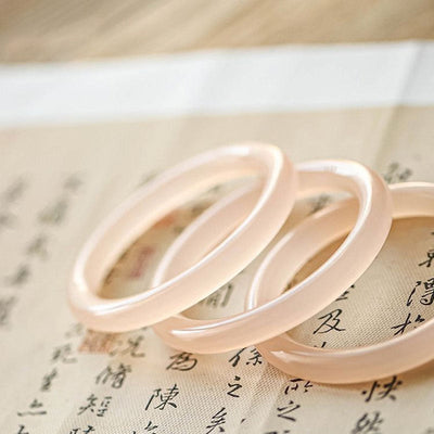 Bracelet d'amour-propre en jade rose de 52 mm pour l'harmonie et la paix