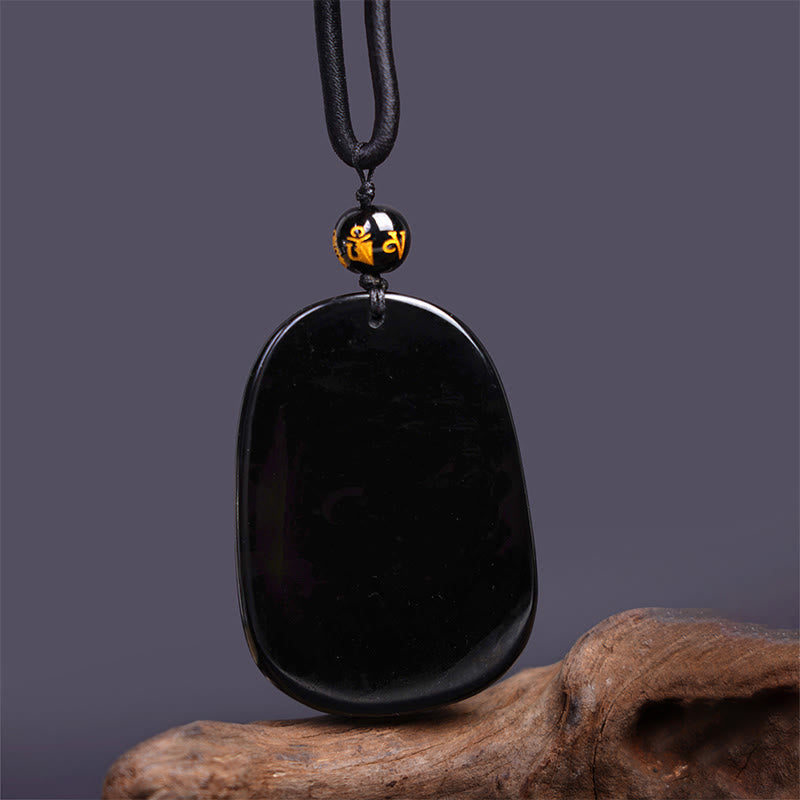 Collier en obsidienne noire sculpté avec un dragon pour la chance et la protection