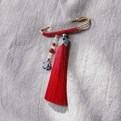 Broche à pompons en perles de calcédoine colorées pour une énergie positive