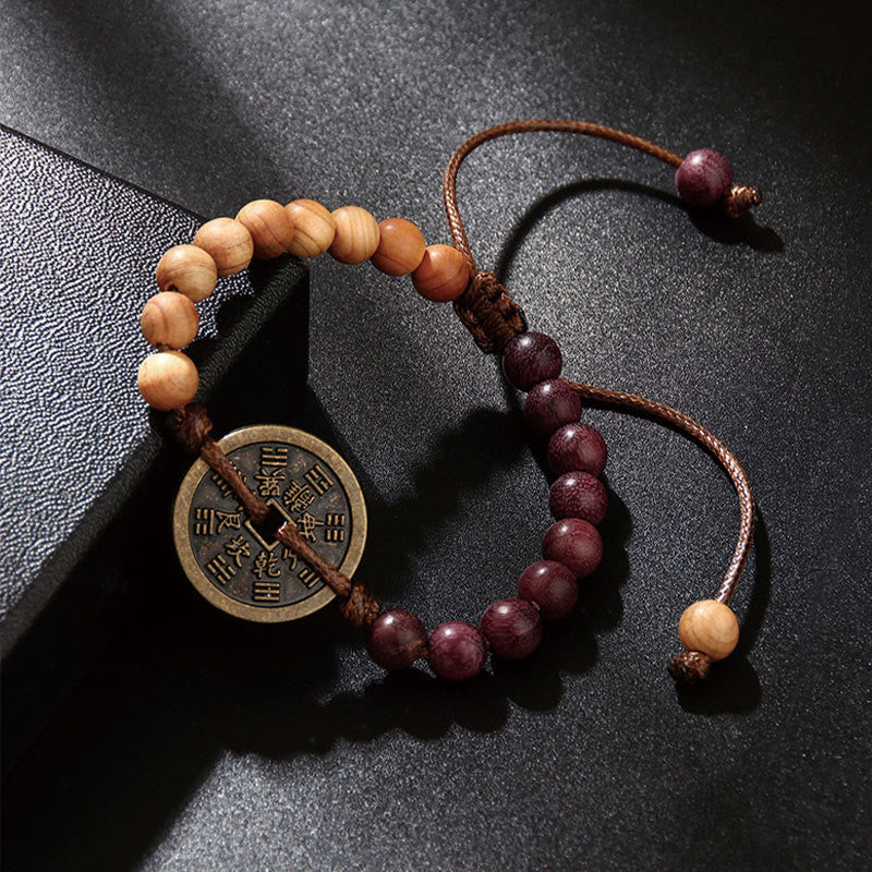 Bracelet de protection en bois d'ébène et pièces de cuivre Bagua