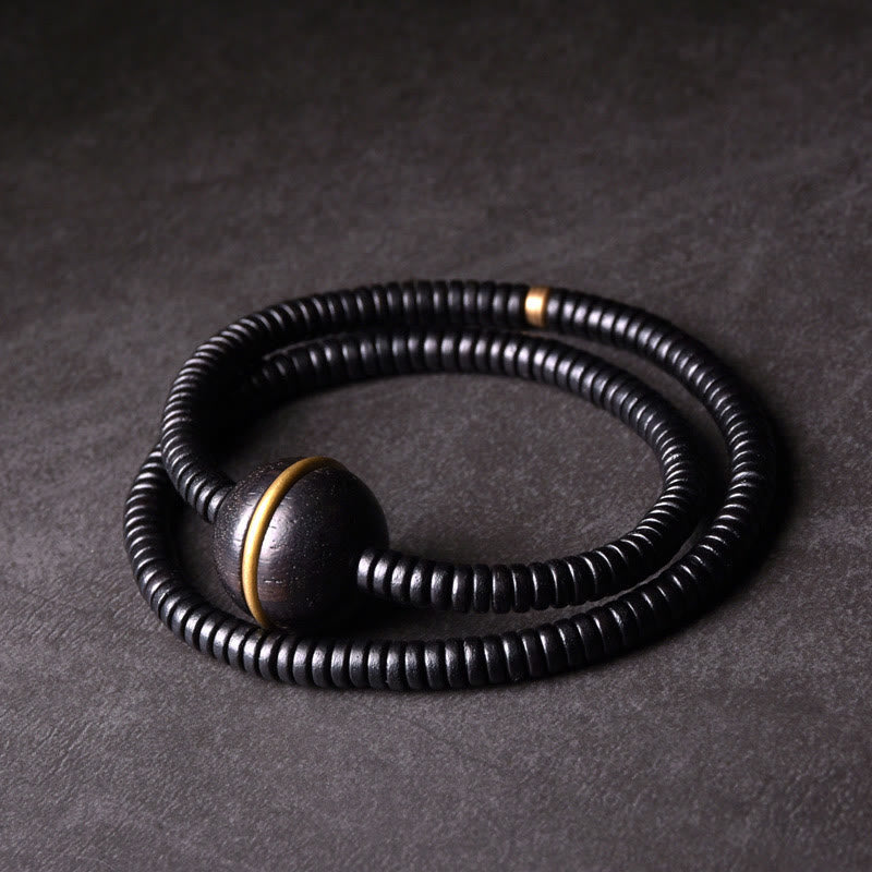 Bracelet boule en laiton et bois d'ébène de 18 mm pour l'équilibre et le calme