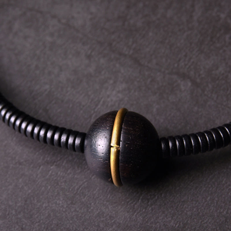 Bracelet boule en laiton et bois d'ébène de 18 mm pour l'équilibre et le calme