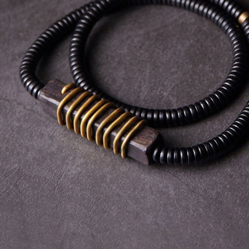 Bracelet boule en laiton et bois d'ébène de 18 mm pour l'équilibre et le calme
