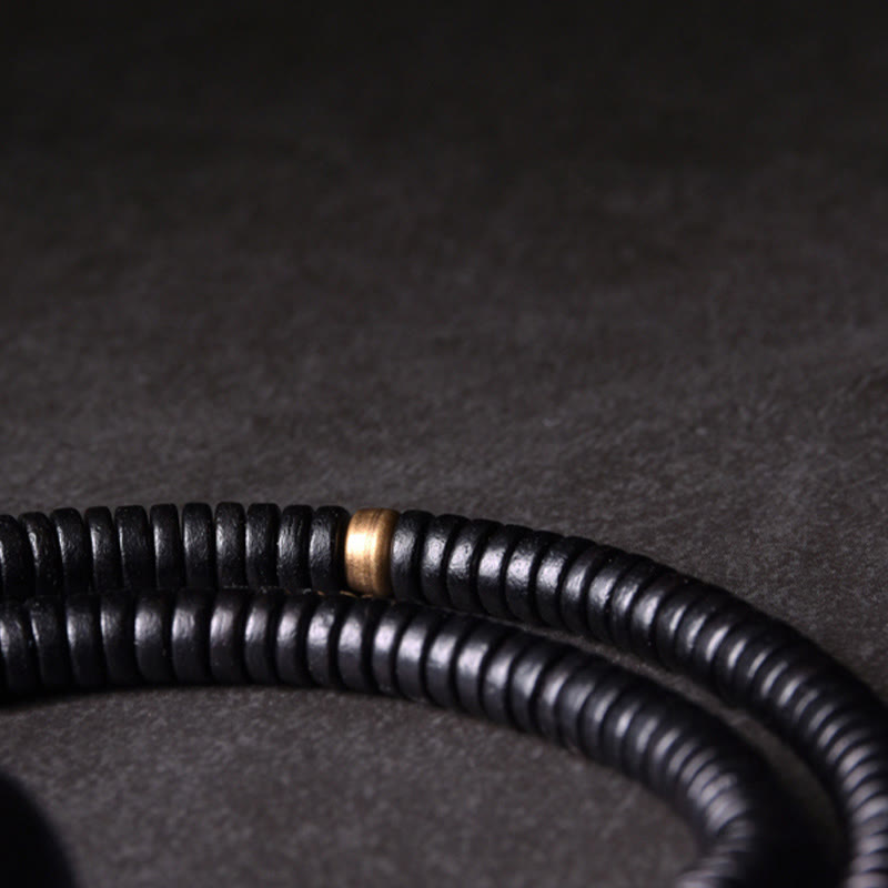 Bracelet boule en laiton et bois d'ébène de 18 mm pour l'équilibre et le calme
