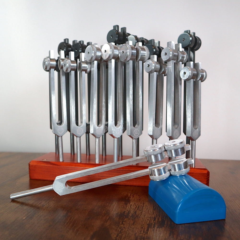 Set of tuning forks on red and blue base for Chakra and Solfeggio healing