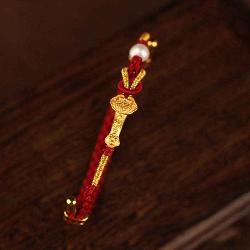 Bracelet porte-bonheur en or 24 carats avec fil rouge