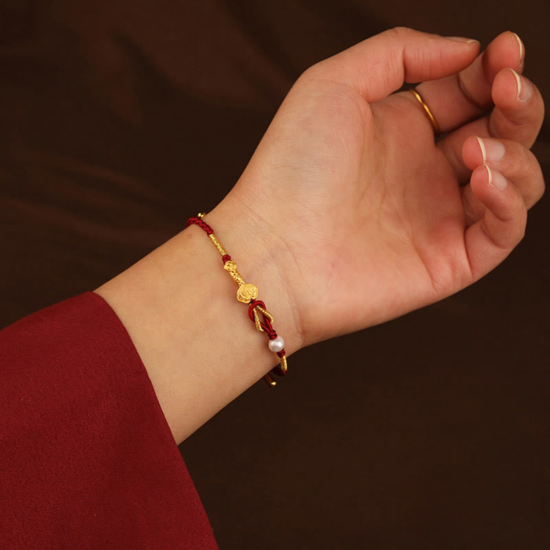 Bracelet porte-bonheur en or 24 carats avec fil rouge