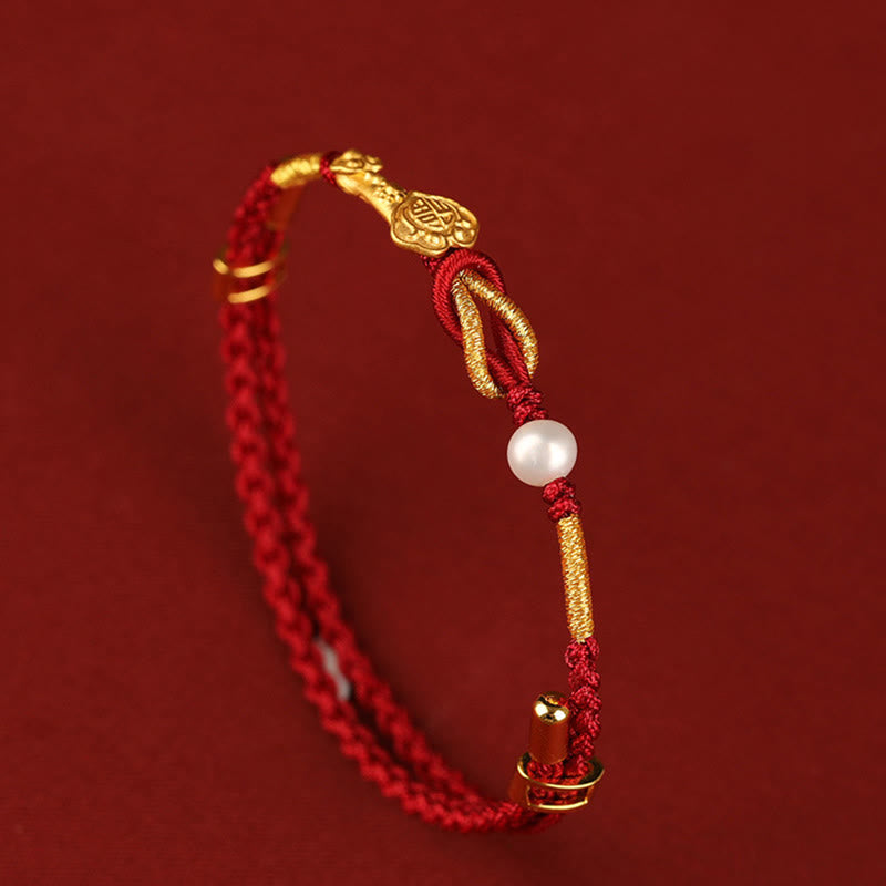 Bracelet porte-bonheur en or 24 carats avec fil rouge